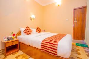 Katil atau katil-katil dalam bilik di Hotel Liberty