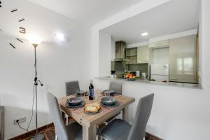 a dining room with a wooden table and chairs at Family-Friendly Andorra Accommodation - Happy Rentals in El Tarter