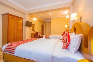 Katil atau katil-katil dalam bilik di Hotel Liberty