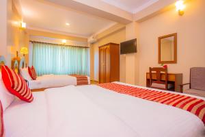 Katil atau katil-katil dalam bilik di Hotel Liberty