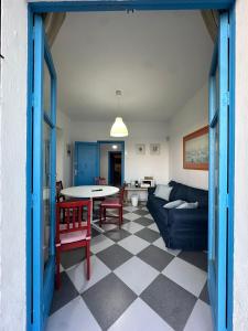 a living room with a couch and a table at Cala Regla by Bossh! Apartments in Chipiona