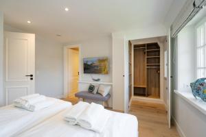 Postel nebo postele na pokoji v ubytování Haus Carstensen Nord