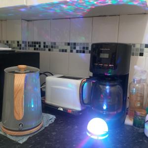 a blender sitting on a counter next to a toaster at Wara in Kingston upon Thames