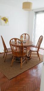 a dining room with a table and two chairs at House in Wollaton, Nottingham in Nottingham