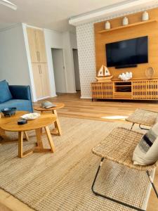 a living room with a couch and a table at Point Village Accommodation - Ocean Two 43 in Mossel Bay