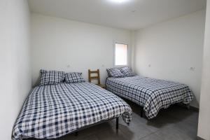 Postel nebo postele na pokoji v ubytování L'Epinette - Gîte de groupe et salle de réception