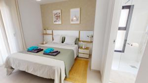 a bedroom with two beds with towels on them at Holidoo Travel "Casa Maru" in San Javier +16 photos