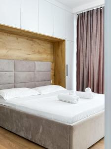 Ένα ή περισσότερα κρεβάτια σε δωμάτιο στο Boulevard Apartment