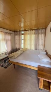 Thangkop House客房内的一张或多张床位