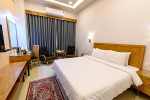 Postel nebo postele na pokoji v ubytování Hotel One Mansehra