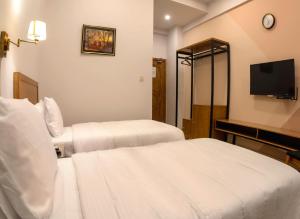 Postel nebo postele na pokoji v ubytování Hotel One Mansehra