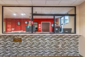 a lobby with a large glass window in a building at Americas Best Value Inn Opelika in Opelika