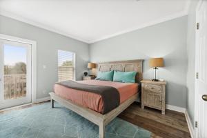 a bedroom with a bed and a window at Rockaway Beach in Santa Rosa Beach +49 photos