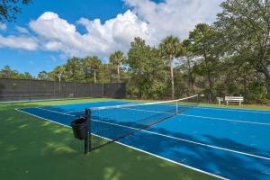a tennis court with a net on it at Rockaway Beach in Santa Rosa Beach