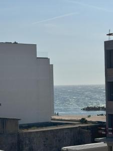 a view of the beach and the ocean from a building at Ferreirinhas - Beach House in Vila do Conde