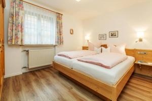 Postel nebo postele na pokoji v ubytování Haus Schmiederer