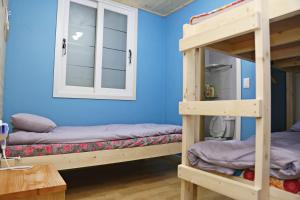 Postel nebo postele na pokoji v ubytování OP 102 Guesthouse