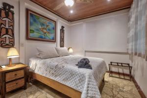 Postel nebo postele na pokoji v ubytování Our Beachfront Bungalow