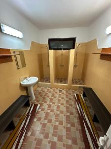 a bathroom with a sink and a toilet at restaurant motel dolorean in Săcele