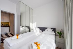 Postel nebo postele na pokoji v ubytování GO Apartments - ApartHotel