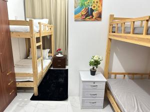 Postel nebo postele na pokoji v ubytování Abu Dhabi Center - Unique Bed Space