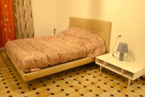 Postel nebo postele na pokoji v ubytování Appartamento Movie nel centro storico di Asti + 3 fotografie