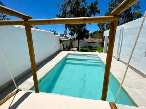 a swimming pool on the roof of a house at Minichalet El Molino 5 in Chiclana de la Frontera