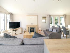 a living room with a couch and a tv at 28 Finch in Scarborough