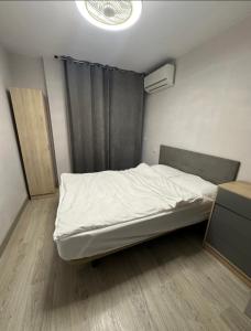 a bed in a small room with a window at Marina in Torrevieja +21 photos