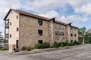 a brick building with graffiti on the side of it at Aloha Beach Resort in Wisconsin Dells