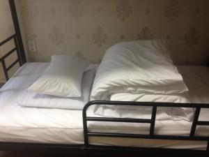 Postel nebo postele na pokoji v ubytování Baramgot Guesthouse