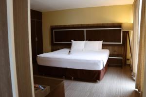 Postel nebo postele na pokoji v ubytování Rado Hotel - Santa María