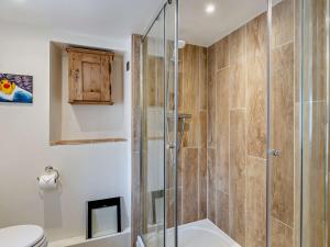a bathroom with a shower and a toilet at 3 Bed in Charmouth 93420 in Charmouth +19 photos