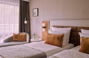 Cama o camas de una habitación en Leonardo Royal Hotel Baden- Baden