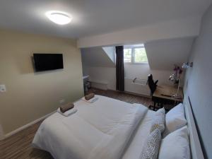 Lova arba lovos apgyvendinimo įstaigoje Arlon Guest House dar 2 nuotraukos