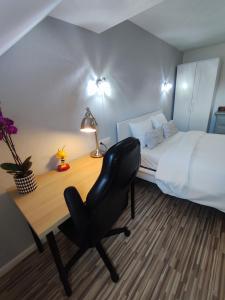 Lova arba lovos apgyvendinimo įstaigoje Arlon Guest House