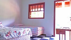 Cama o camas de una habitación en Colinas de Cabreúva