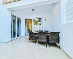 a dining room with a table and chairs at Holiday Cyprus 001 in Polis Chrysochous