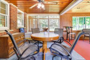 a dining room with a table and chairs at Home about 17 Mi to Detroit with Patio and Grill! in Southfield