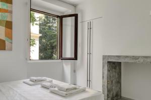 Posteľ alebo postele v izbe v ubytovaní Brera - Bright and cosy 2 bedrooms apt- Via Solferino + 29 fotografií