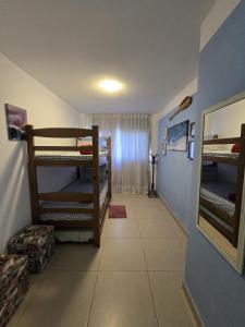 a room with two bunk beds in a room at Cond Mediterrâneo I - Iberostate in Praia do Forte +31 photos