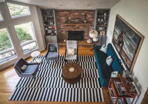 an aerial view of a living room with a fireplace at PREMIUM PROPERTY - Private 2-Acre Retreat - MODERN 4 Bedrooms - See Video Tour in Gloucester +32 photos