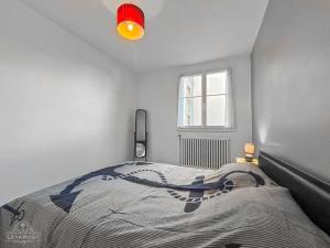 Ένα ή περισσότερα κρεβάτια σε δωμάτιο στο Balcon, Vue dégagée & Proche gare