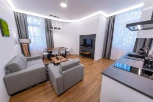 TV a/nebo společenská místnost v ubytování IT Centrum Apartments