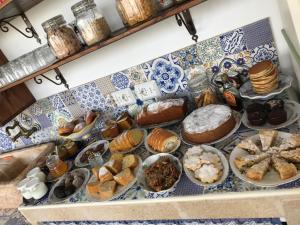 a bunch of different types of pastries on a counter at Bàcula Nzícula Marzamemi in Marzamemi