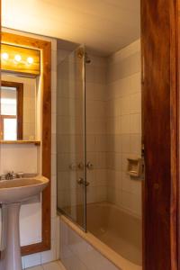 a bathroom with a shower and a sink at Las Rocas By Base 41 in San Carlos de Bariloche +22 photos