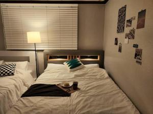 Voodi või voodid majutusasutuse Henzel House - 2min to Yongmun Station, 5mins to Seongsimdang toas