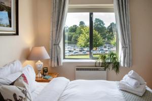 Postel nebo postele na pokoji v ubytování Waterfront View Apartment