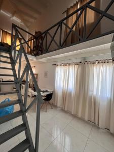a room with a loft bed and a desk at Hospedaje LH primero C a 15 minutos del aeropuerto de Ezeiza in Ezeiza +3 photos