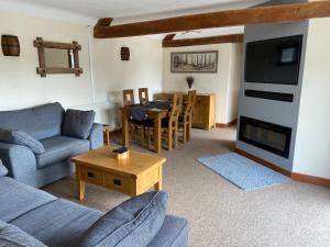 Posezení v ubytování Stable Cottage, Old Mill Farm, Cotswold Water Park